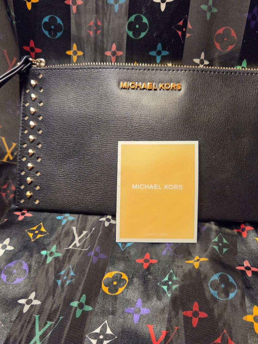MICHAEL KORS Black Leather Wristlet Clutch with Gold Logo
